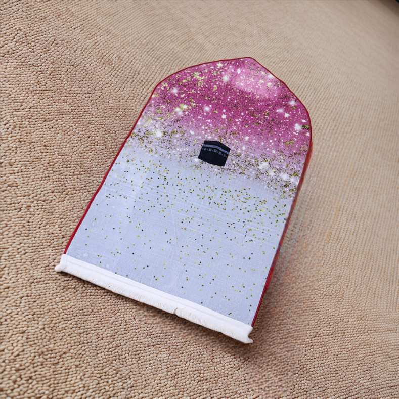 Glittery pink to white gradient headscarf with a black graphic on a beige surface