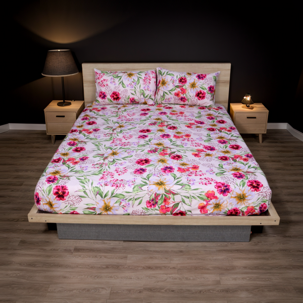 Bed with floral bedding in a bedroom setting with nightstands and lamps.