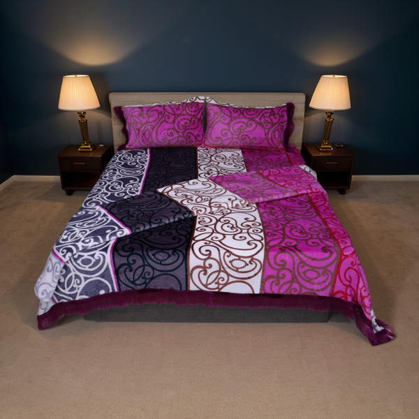 Bedroom with a bed covered in a purple and white patterned comforter, two lamps on nightstands, and dark walls.
