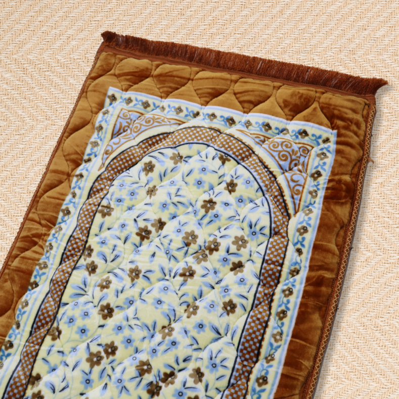 Decorative prayer mat with floral pattern on a beige background