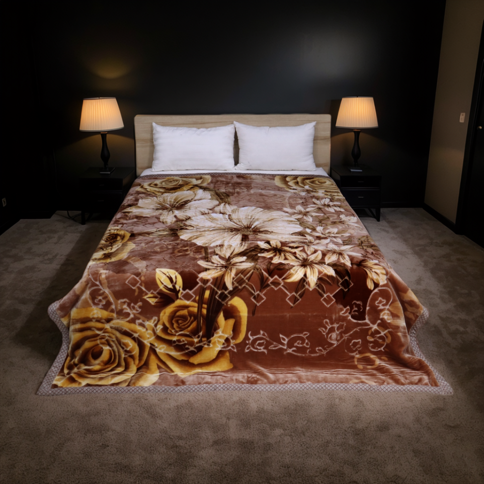 Floral patterned blanket on a bed in a dimly lit room with lamps.