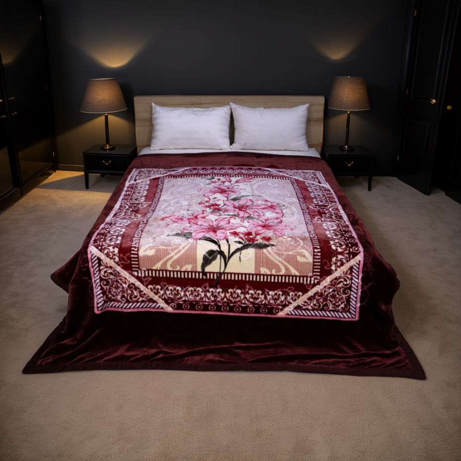 Bed with a decorative floral blanket in a dimly lit bedroom