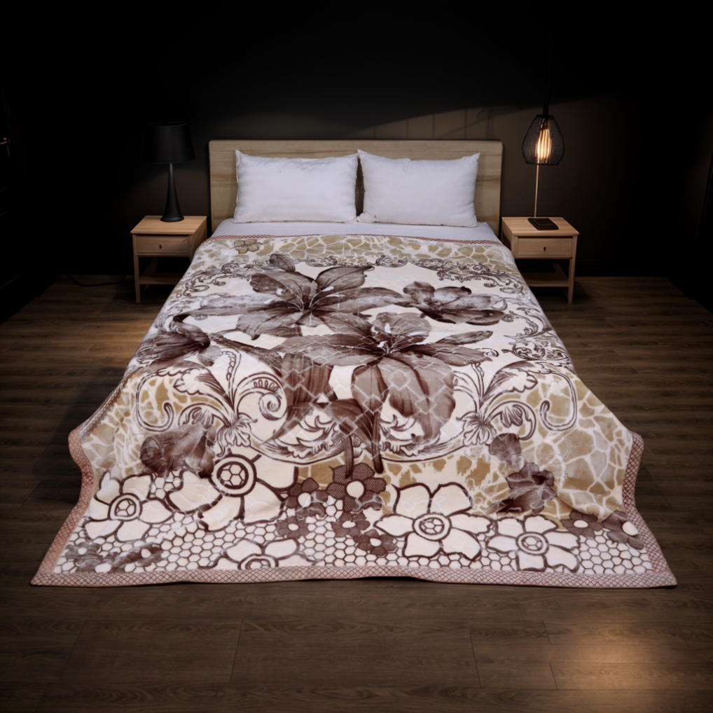 Floral patterned comforter on a bed in a dimly lit bedroom