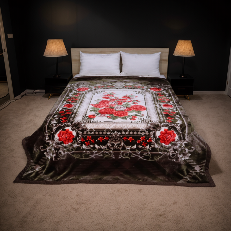 Decorative floral quilt on a bed in a bedroom with lamps and dark walls.