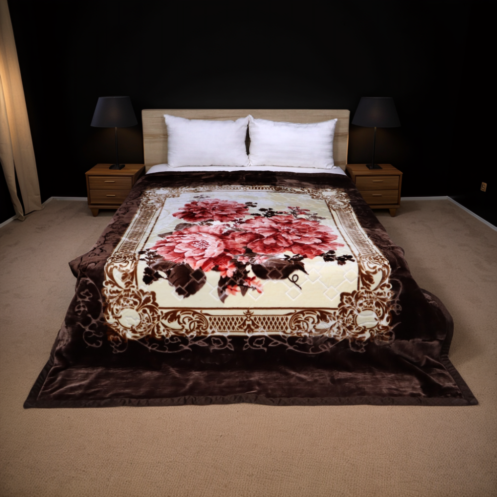 Decorative floral blanket on a bed in a dimly lit bedroom