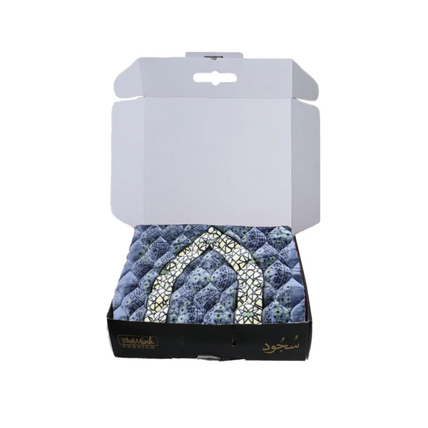 Blue textured product with a white pattern in a white box on a white background