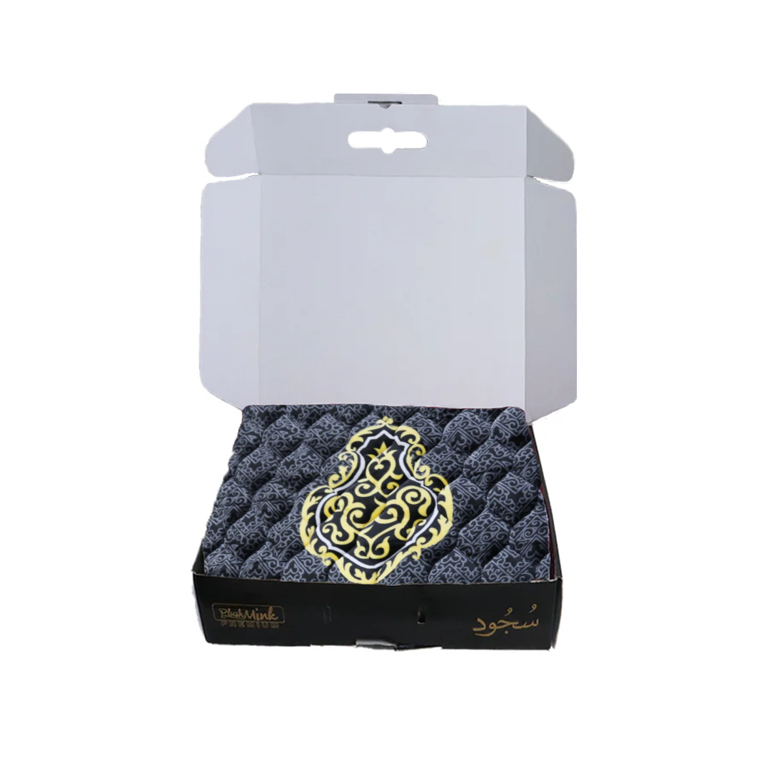 Decorative black and gold item in a white box on a white background perfect for gifting in Pakistan