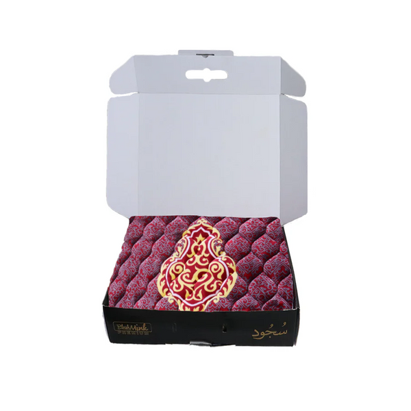 Decorative box with red and gold pattern on a white background perfect for gifting 