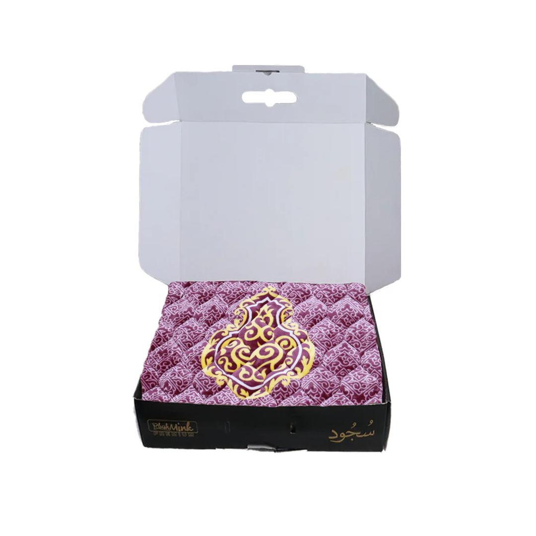 Decorative box with a purple pattern and gold emblem on a white background perfect for gifting in Pakistan 